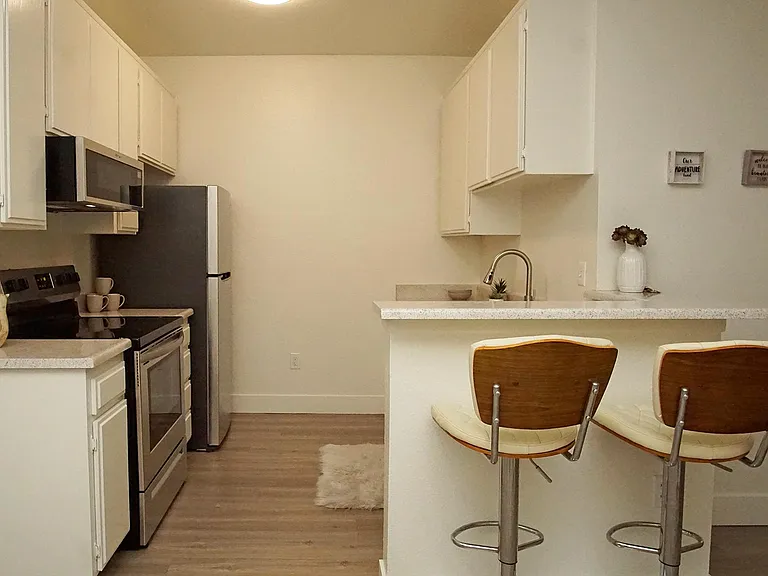 Spacious kitchens with new stainless steel appliances including dishwasher