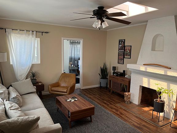 Family Room. Bright, sunny and airy. Decorative fireplace. Skylight.