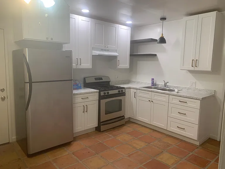 New cabinets, countertops, sink and lighting