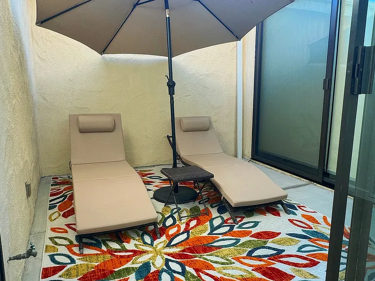 Cozy, private atrium, accessible from dining room and primary bedroom