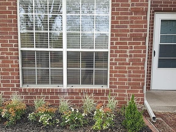 Lots of windows and light - 2" slatted blinds in all rooms - Storm door with screen for air ventilation