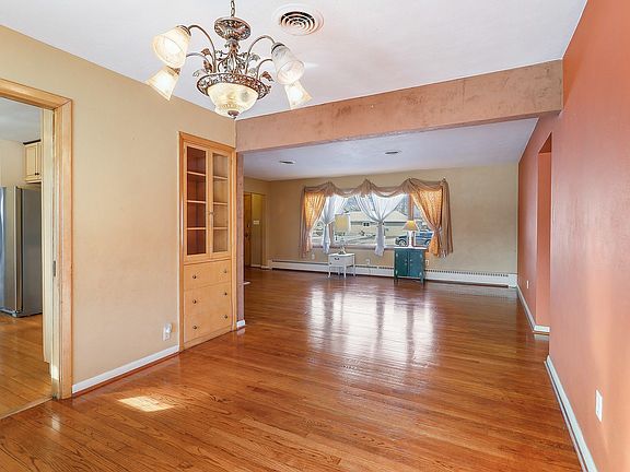 A pocket door in the dining room leads into the Kitchen.  An original built-in china cabinet is tuck