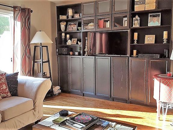 Huge shelving unit, with large flat-screen TV