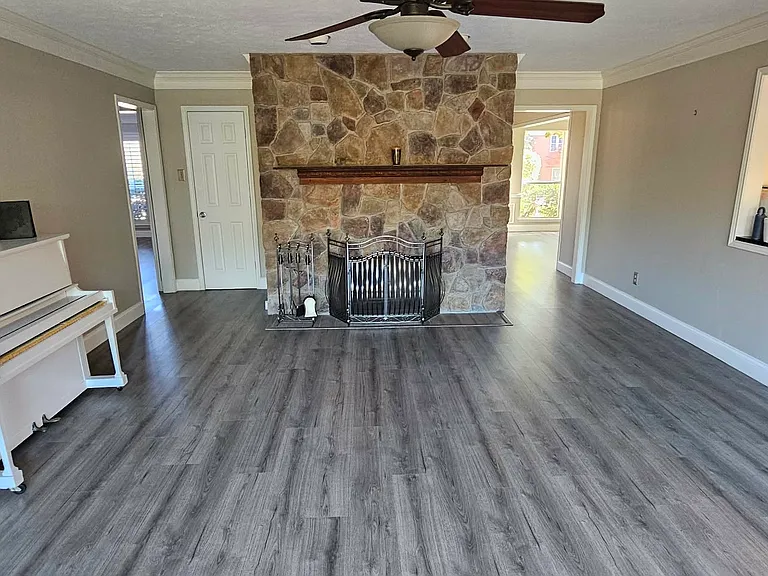 Family room has a stone gas fireplace that was never used by the owners.