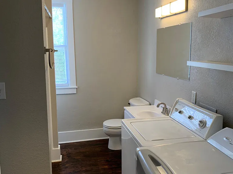 Bathroom with washer and dryer