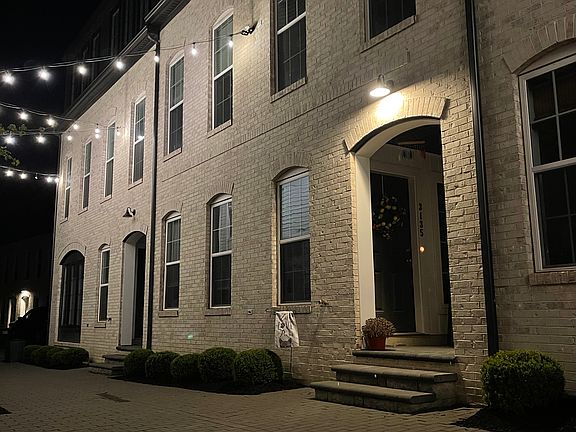 Entrance of the house , beautifully lit up every evening, making it look festive year round.