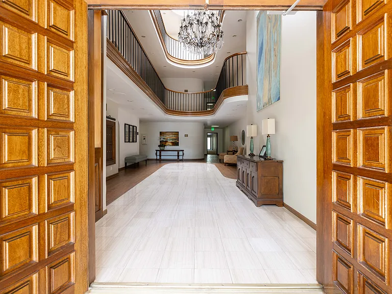 A beautiful building Lobby and the design of the open 3 story foyer allows for a no side common walls condo