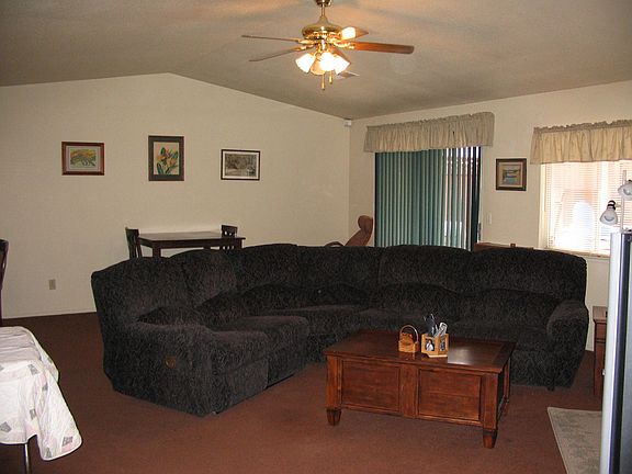 Greatroom w/fireplace and sliding glass door to backyard.