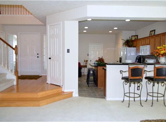 Open floor plan with lots of light and high ceilings.