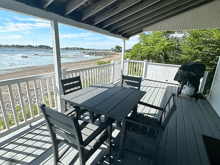 Beach side Porch with Table and Gas Grill in the background