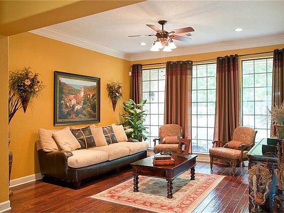  The formal living room looks out over the wooded back yard - an ideal place for a quiet read.