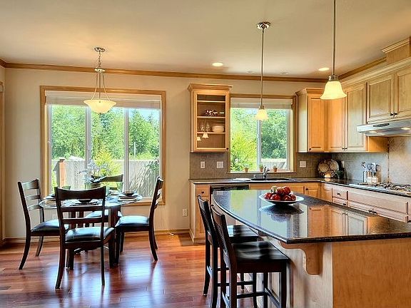 Granite slab countertops, hardwood floors, top quality stainless steel applian