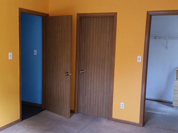 Master bedroom with en suite bathroom and walk-in closet