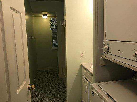 Galley bathroom with in unit full size W/D.