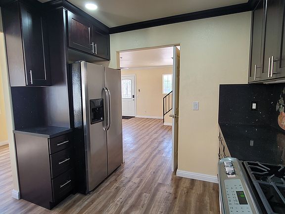New cabinets, ample storage, Kitchen with hand-crafted granite inlays