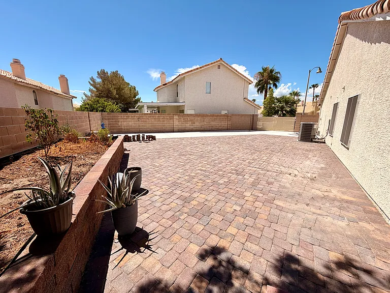 Raised garden, RV parking, side patio.