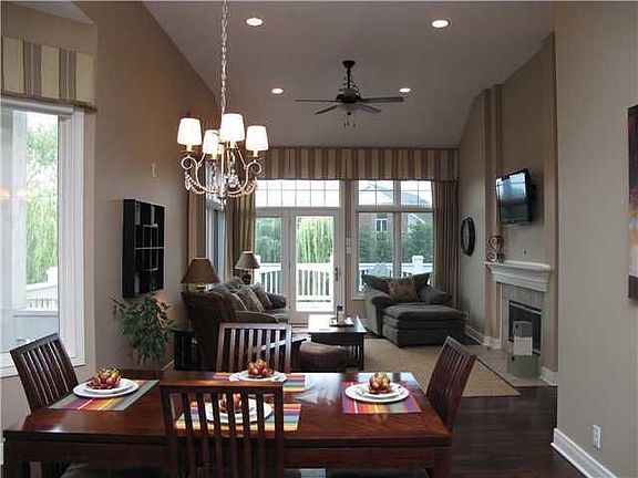 Hearth Rm w/Wood Floors, Water views, & Access to Screened-In Porch & Deck.