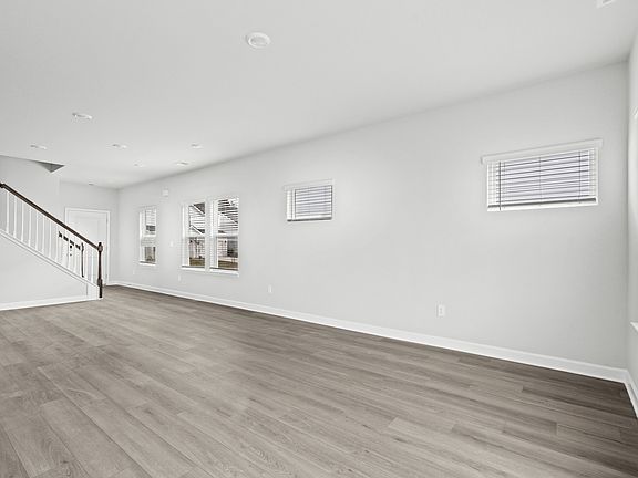 The great room comes with plenty of space that is great for hosting or relaxing with family.