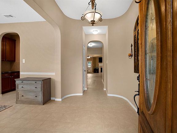 Welcome home! Tile in all the main areas, neutral paint and fabulous arches throughout the home.
