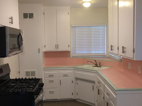 Kitchen with Stove and over the counter top microwave