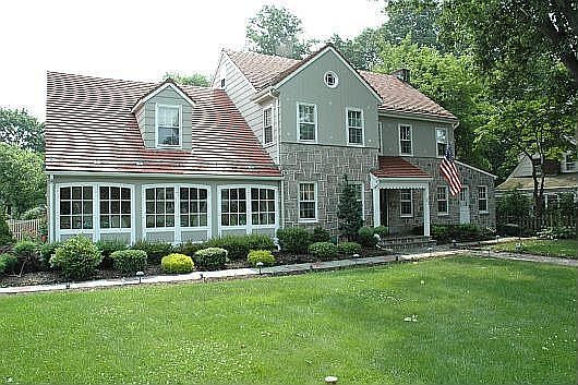 Clay Tile Roof / Fieldstone / Cedar Siding 