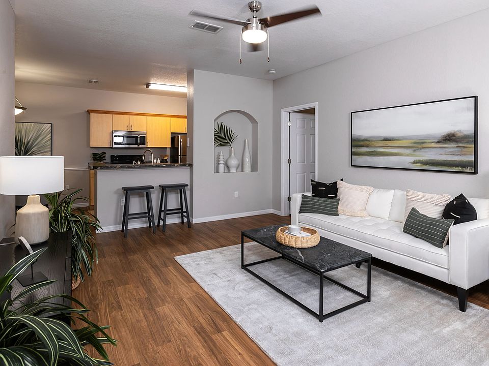 This beautifully designed living room offers an open flow to the modern kitchen, perfect for entertaining and relaxation.