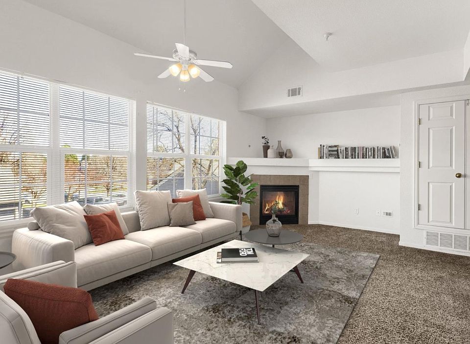Spacious Living Room with Natural Light, Electric Fireplace and New Carpet (virtually staged)