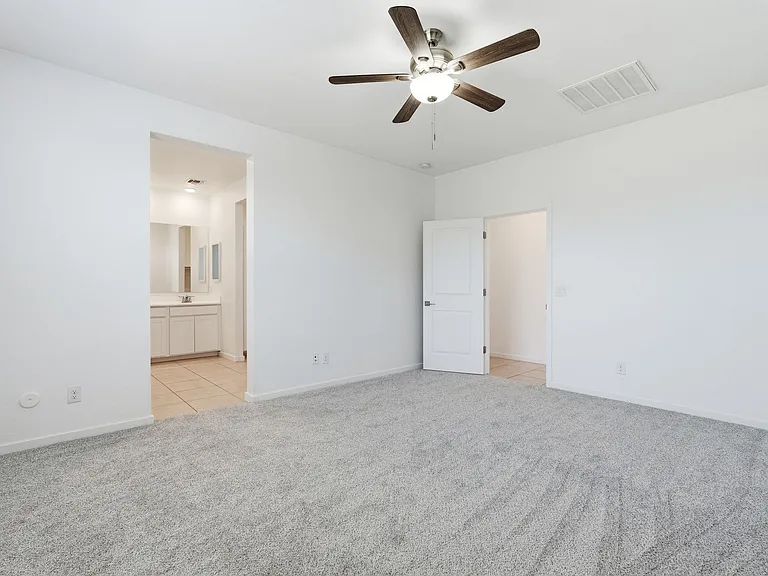 Primary bedroom into bathroom