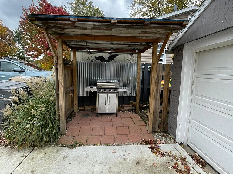 Outdoor covered area adjacent to garage (Grill included in rent)