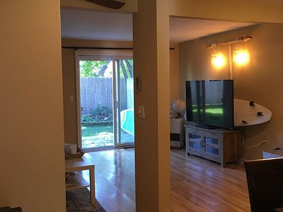 From hall looking into living room / dining area.