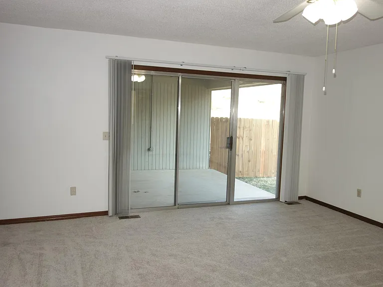 Master bedroom sliding patio doors to covered patio!