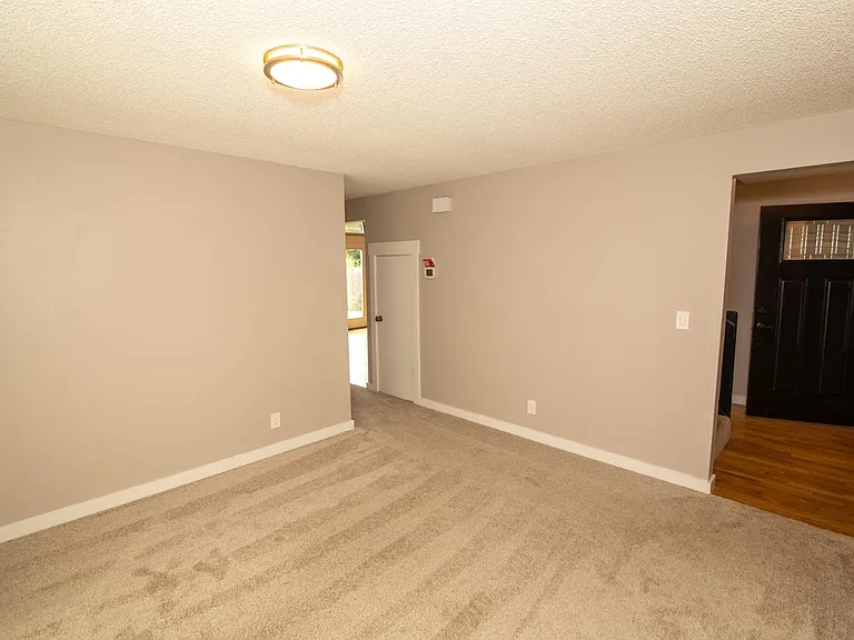 View of laundry area (extra small room), off from the front door.