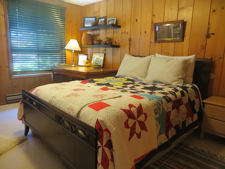 Bedroom with double bed, cozy wool carpeting
