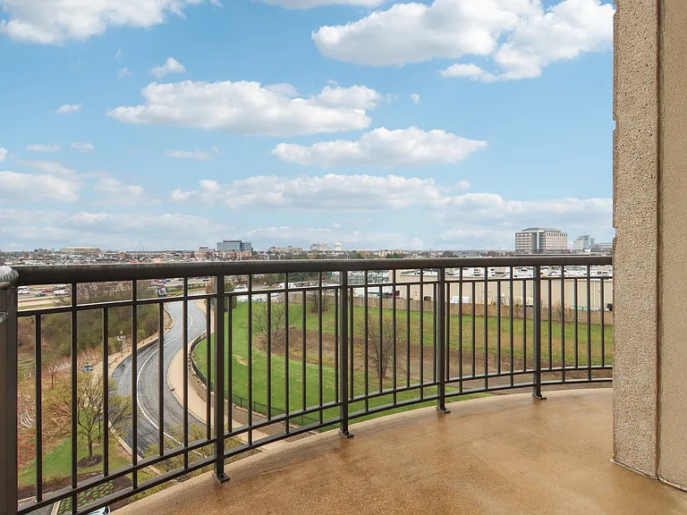 Private balcony with sweeping city and field views