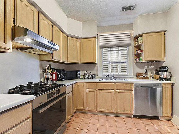 Spacious kitchen with stainless steel appliances, lots of storage and pantry (not in photograph).