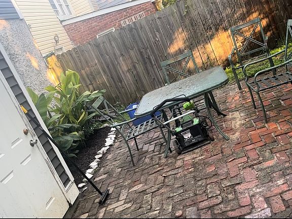 patio in fenced back yard