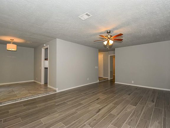 Looking from the fire place to entry hall. To the left is the Formal Dining with bay window and tile flooring.