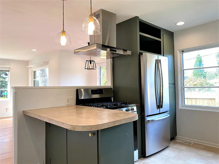 Updated appliances with counter depth French door refrigerator.