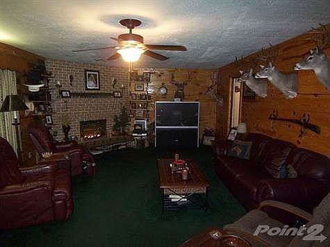 The centrally located wood burning fireplace makes the family room warm and cozy.