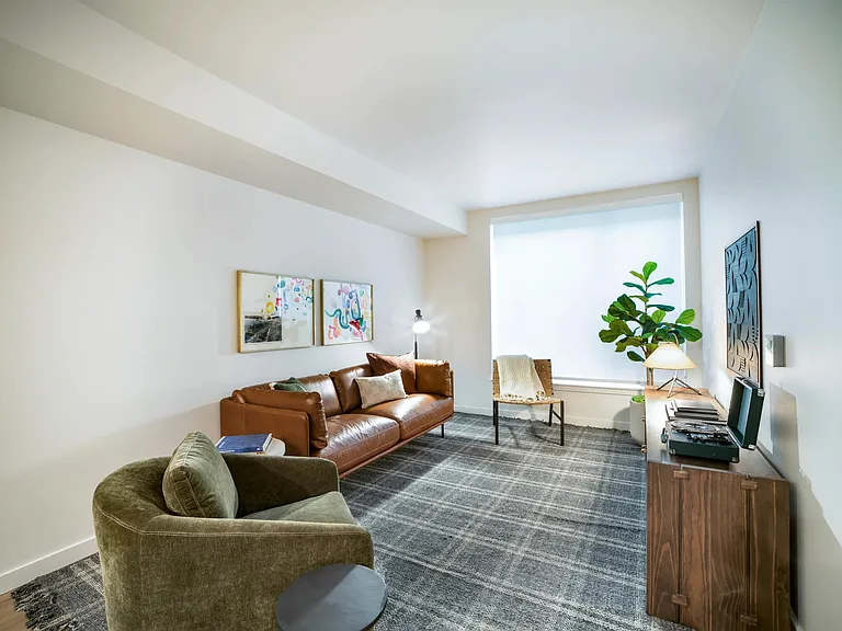 Clean lines and natural textures define this Modera Shoreline home, offering a bright and comfortable space to unwind near Seattle's scenic coast.