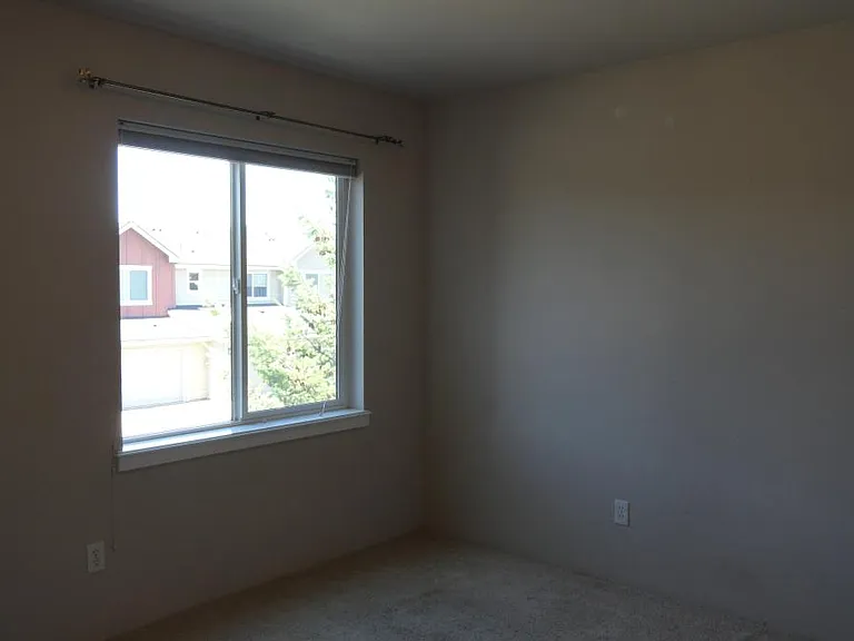 Third Bedroom with large window, new Ductless heat and AC (not shown) and new carpet is being installed.