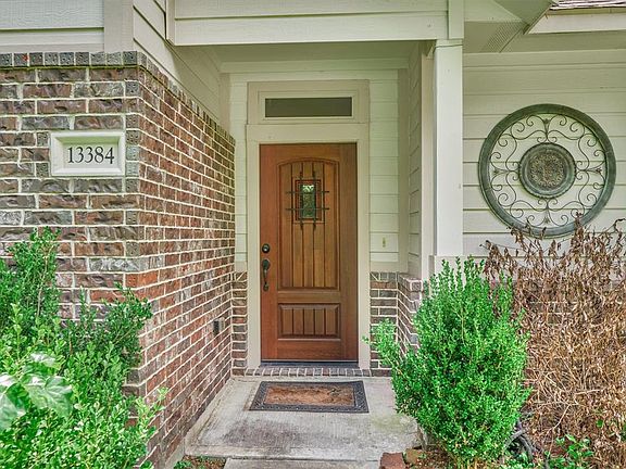 Solid wood front door with speakeasy accent to welcome friends and family.