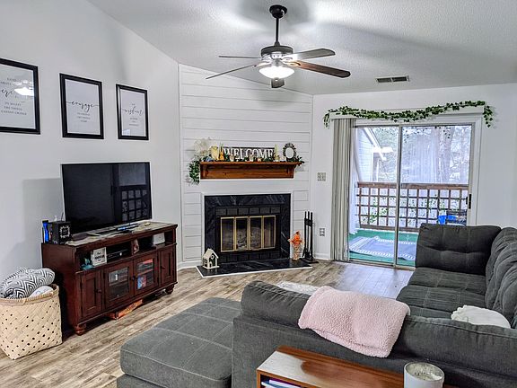 Living Room with Fireplace and Balcony