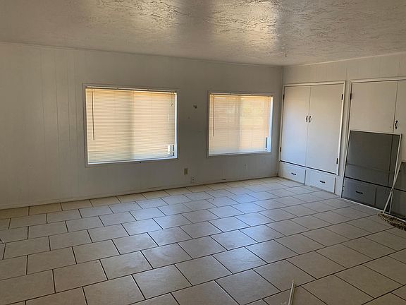 Tiled bonus room with storage