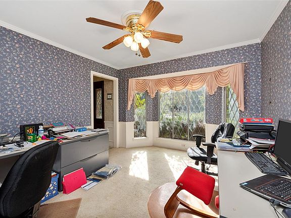 Formal dining room being used as an office. Once again, seller moving out soon.