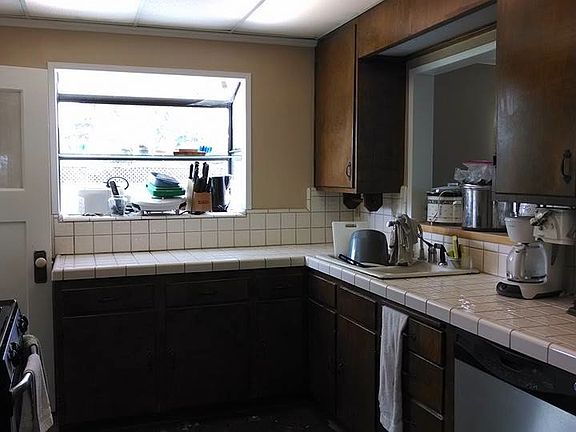 Kitchen with attached walk-in pantry