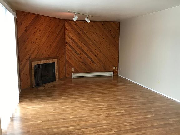 Living room with sliding door on left going to Deck.