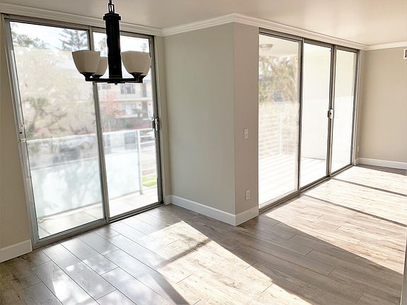 Sunlight floods through the large front windows