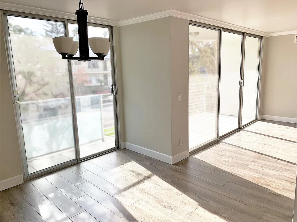 Sunlight floods through the large front windows
