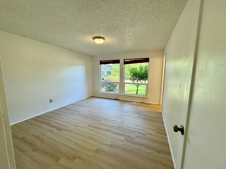 Master bedroom with large windows for natural light